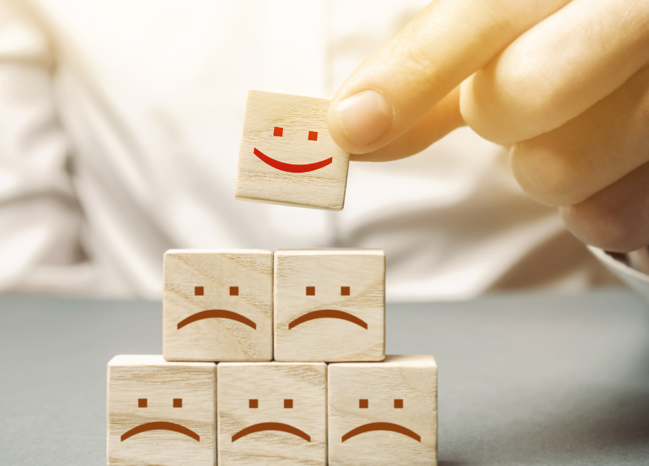 traurige Smileys ein lachendes Smiley darauf